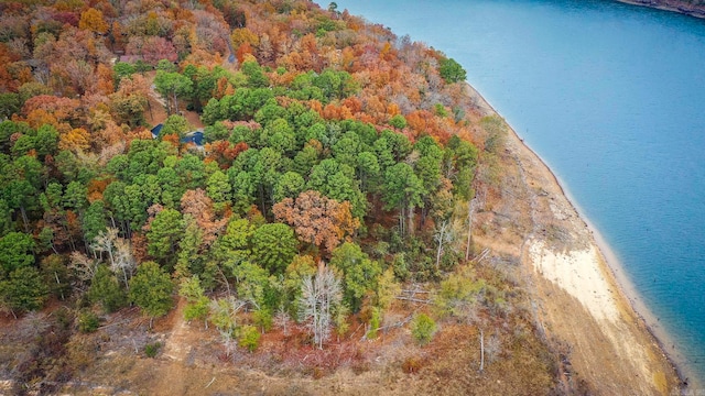 birds eye view of property featuring a beach view and a water view