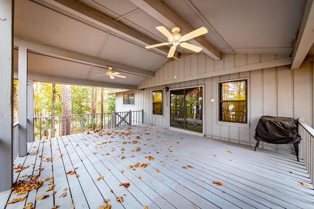 wooden deck with grilling area and ceiling fan