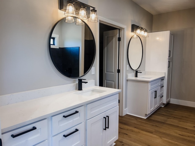 bathroom with hardwood / wood-style flooring and vanity