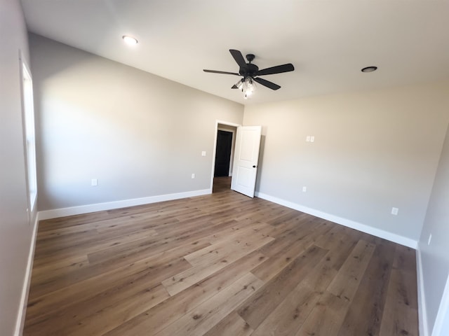 unfurnished bedroom featuring ceiling fan and hardwood / wood-style flooring