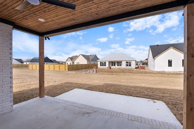 view of yard with a patio and ceiling fan