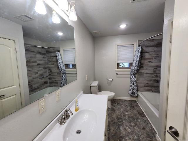 full bathroom featuring toilet, vanity, and shower / tub combo