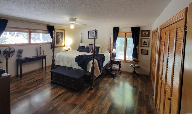 bedroom featuring a textured ceiling, dark hardwood / wood-style flooring, ceiling fan, and a closet