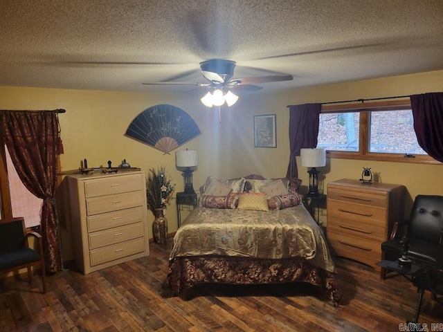 bedroom with a textured ceiling, dark hardwood / wood-style flooring, and ceiling fan