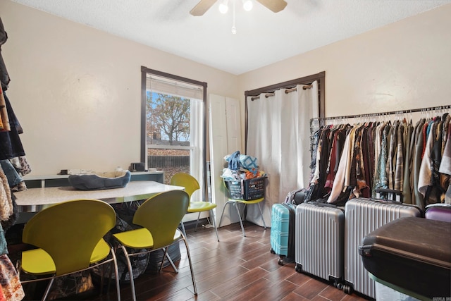 dining area featuring ceiling fan and dark hardwood / wood-style floors