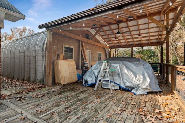 exterior space featuring ceiling fan