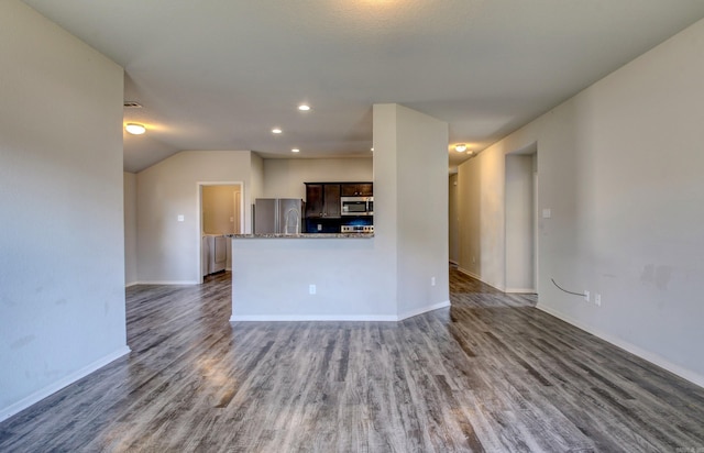 103 Harvest Dr, Beebe, AR 72012 - unfurnished living room featuring wood finished floors, baseboards, recessed lighting, and vaulted ceiling