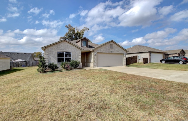 view of front facade featuring a front yard and a garage