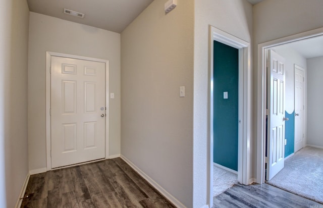 hallway featuring dark hardwood / wood-style floors