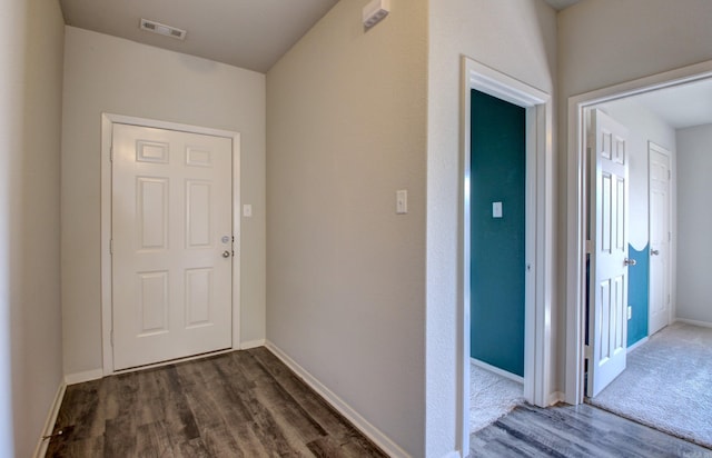 103 Harvest Dr, Beebe, AR 72012 - hallway featuring dark wood-type flooring and baseboards