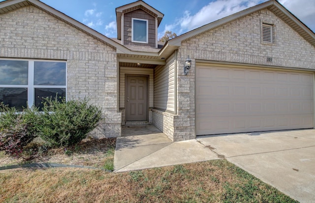 view of front of property with a garage