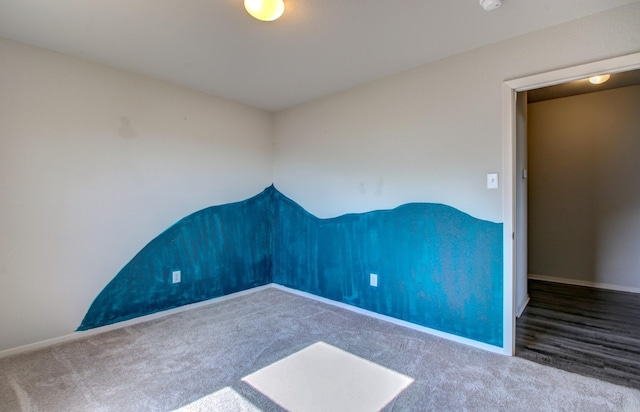 unfurnished room featuring carpet floors