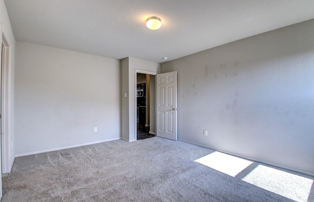 unfurnished bedroom with light colored carpet