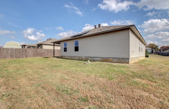 back of house featuring a yard