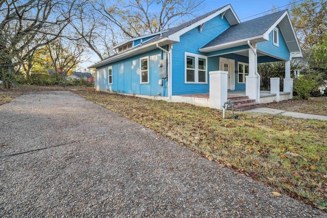 view of property exterior with a porch