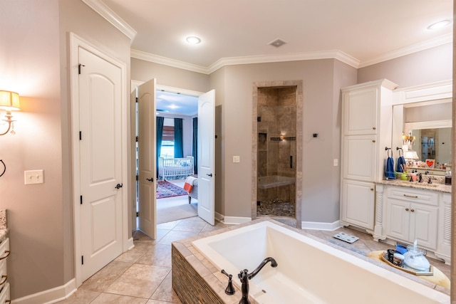 bathroom featuring vanity, separate shower and tub, ornamental molding, and tile patterned flooring