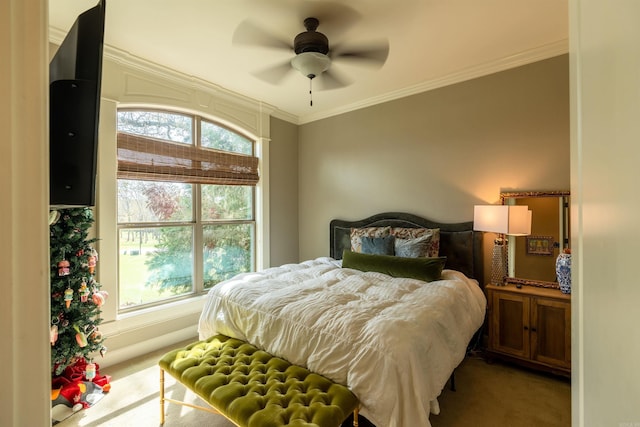 bedroom with light carpet, ornamental molding, and ceiling fan