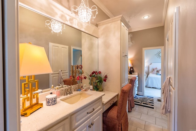 bathroom with vanity, an inviting chandelier, ornamental molding, and tile patterned floors