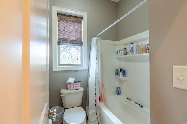 bathroom with shower / tub combo and toilet