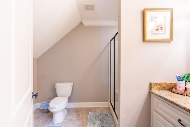 bathroom with vanity, toilet, walk in shower, and lofted ceiling