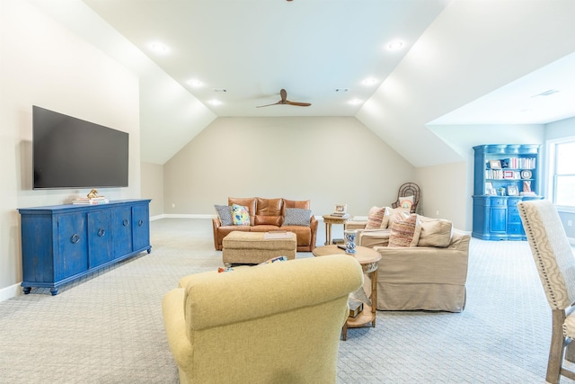 carpeted living room with vaulted ceiling and ceiling fan