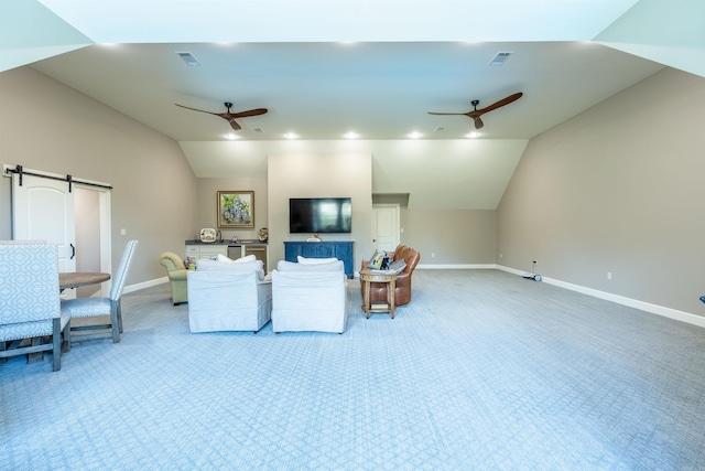 living room with lofted ceiling, carpet floors, a barn door, and ceiling fan