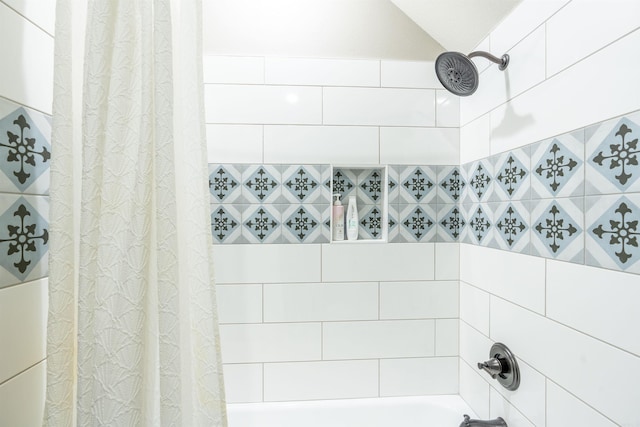 bathroom with shower / tub combo with curtain