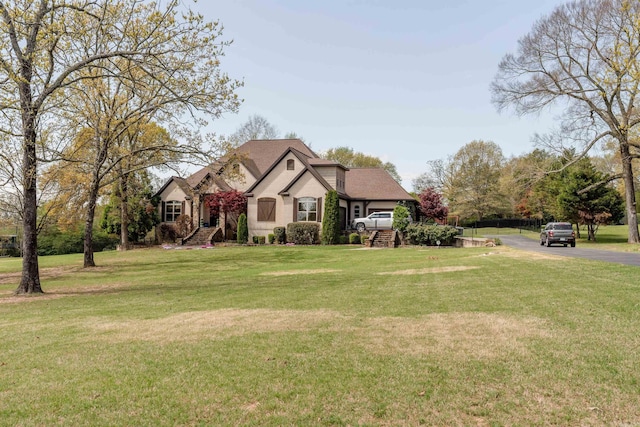 view of front of home featuring a front lawn