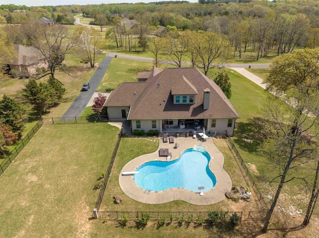 view of pool featuring a patio, a diving board, and a lawn