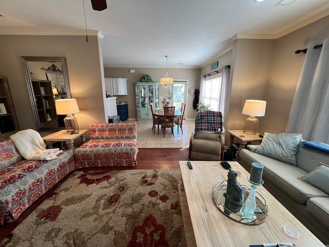 living room with ornamental molding and wood-type flooring