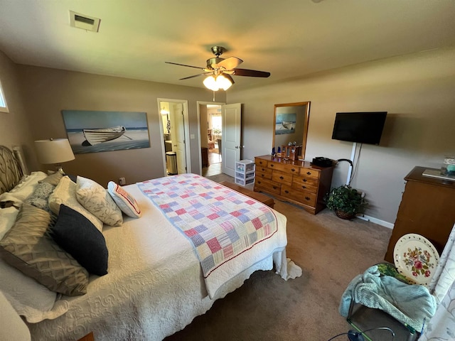 bedroom with ensuite bath, carpet, and ceiling fan