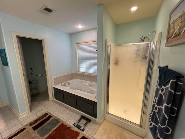 bathroom with independent shower and bath and tile patterned floors