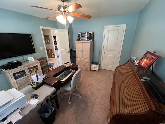 home office with ceiling fan and carpet floors