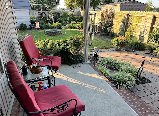 view of patio with a fire pit