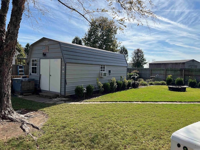 view of outbuilding featuring a lawn and cooling unit