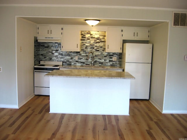 kitchen with white appliances, tasteful backsplash, sink, white cabinetry, and dark hardwood / wood-style floors