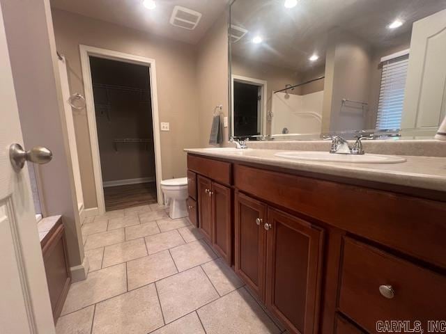 bathroom with vanity, toilet, tile patterned floors, and a shower with shower curtain