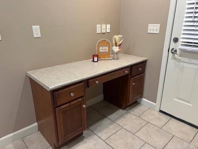 interior space featuring vanity and tile patterned floors