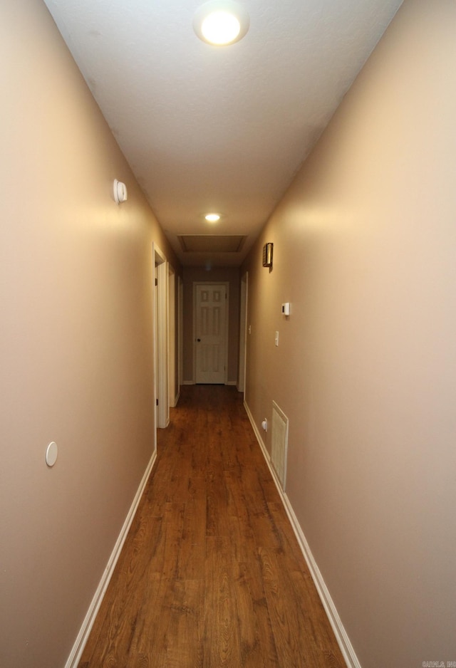 hall with dark hardwood / wood-style floors