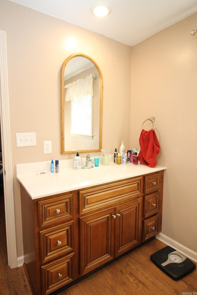 bathroom with vanity and hardwood / wood-style floors