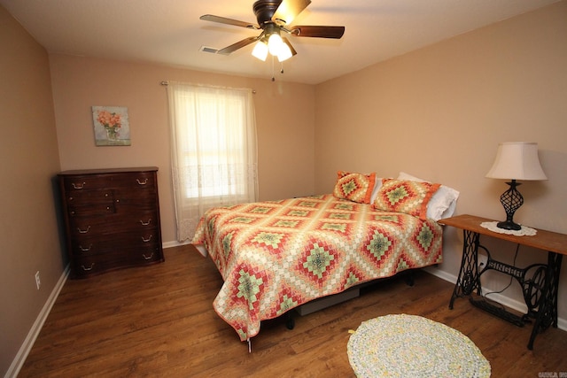 bedroom with dark wood-type flooring and ceiling fan