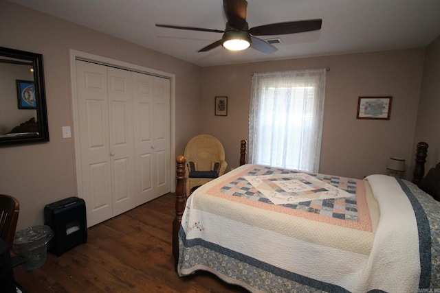 bedroom with a closet, ceiling fan, and dark hardwood / wood-style floors