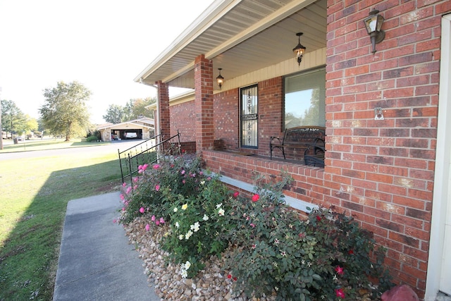 entrance to property with a yard and a porch