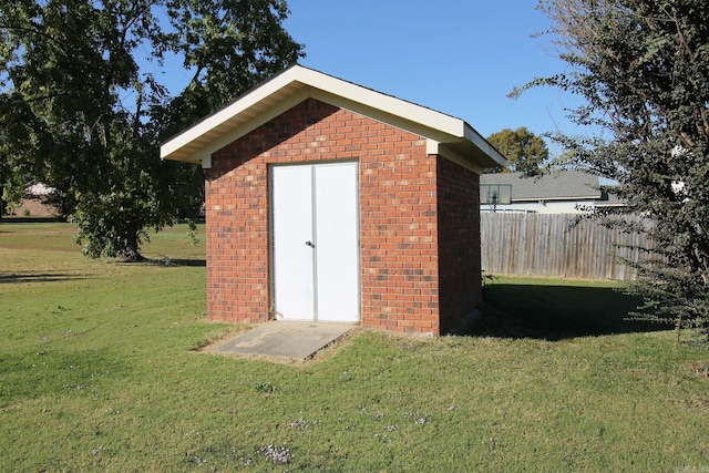 view of outdoor structure with a lawn