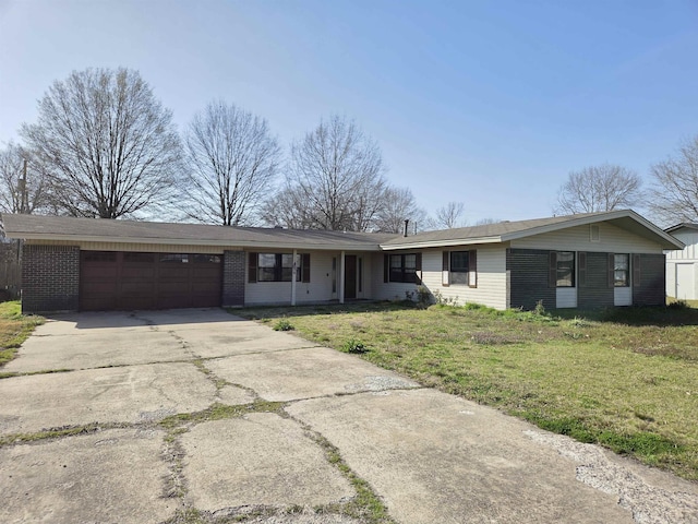 single story home with a front yard, brick siding, driveway, and a garage
