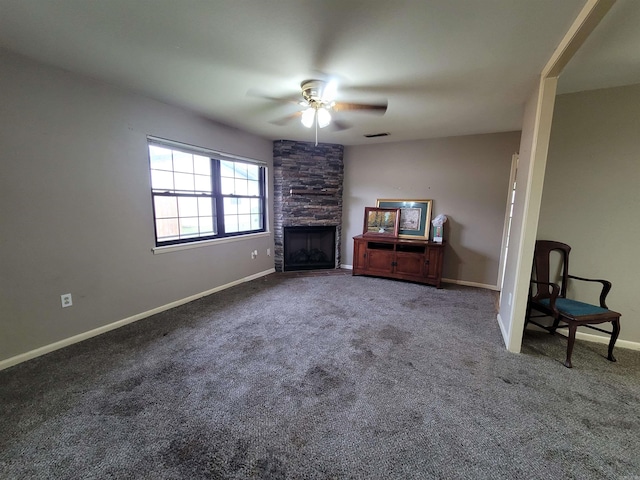 unfurnished living room featuring carpet, a fireplace, and ceiling fan