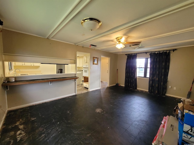 unfurnished living room featuring ceiling fan