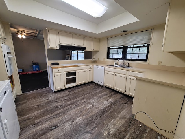 kitchen with white cabinets, dark hardwood / wood-style flooring, white appliances, and sink