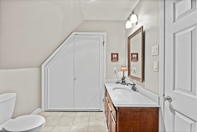 bathroom with vanity, toilet, and tile patterned floors