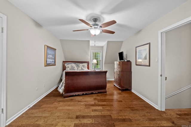 bedroom featuring dark hardwood / wood-style flooring and ceiling fan